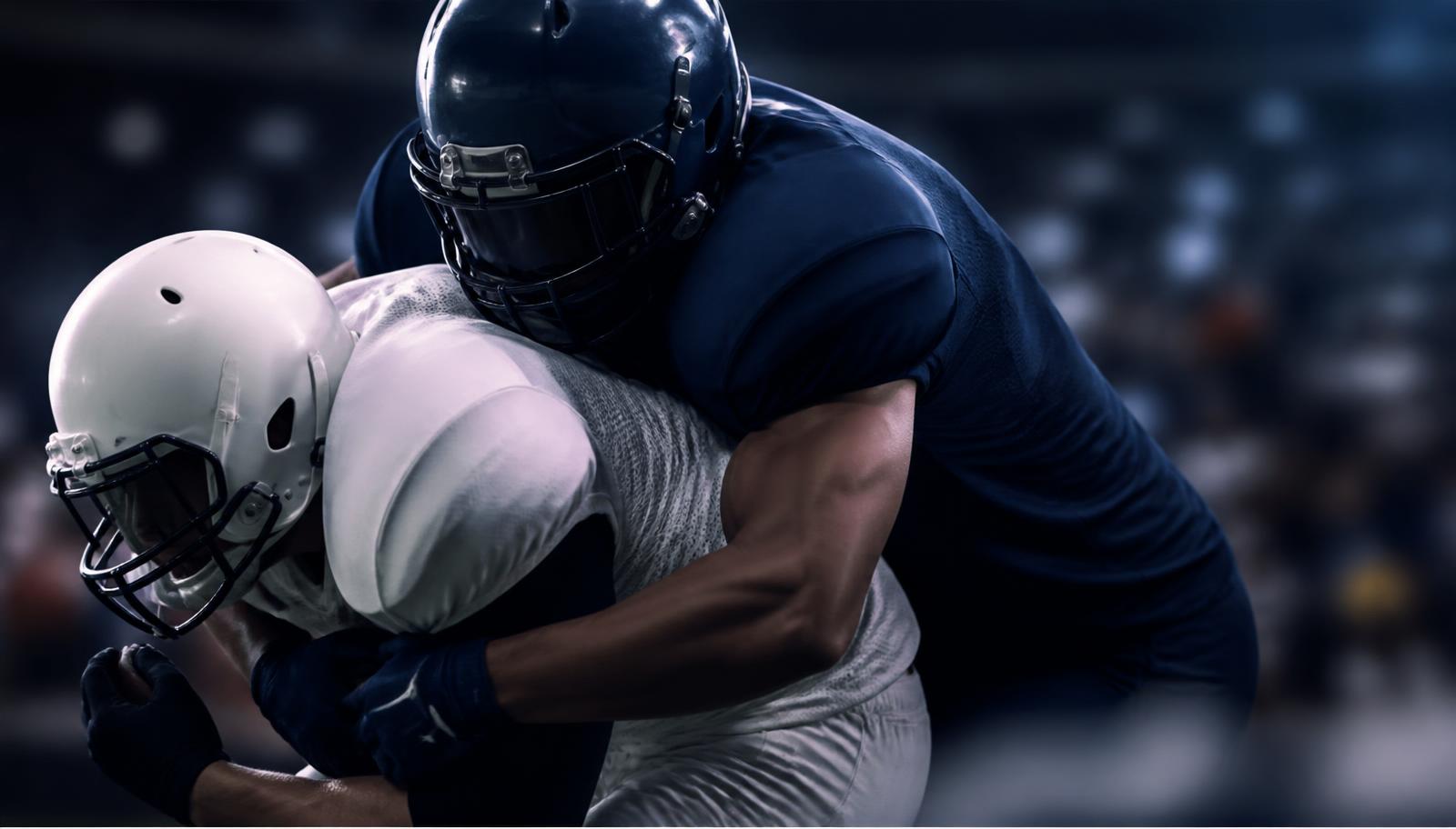 Defender wrapping up a ball carrier